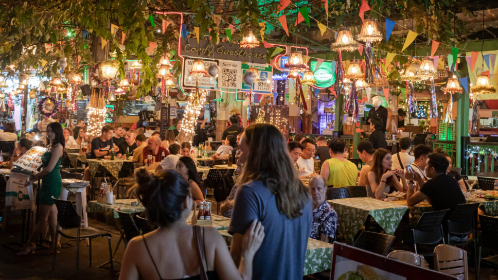 People in a cosy busy restaurant enjoying their evening